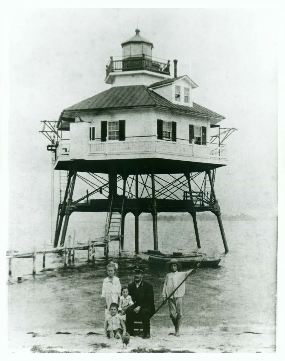 A keeper's family on the steps of a remote lighthouse station