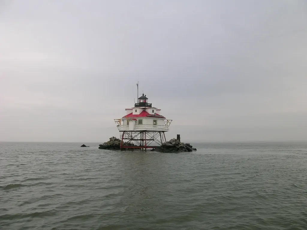 The Thomas Point Shoal screw-pile lighthouse standing on iron legs over Chesapeake Bay